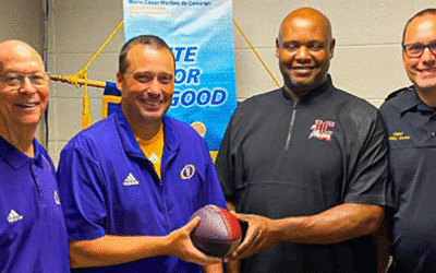 Two South Georgia Rotary Clubs Run a Relay from one Football Stadium to the Other to Mark Cross-County Rivalry