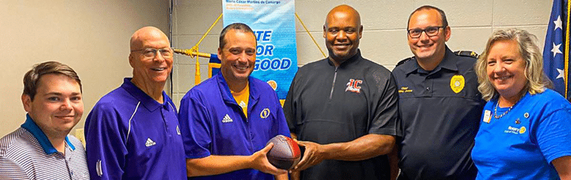Two South Georgia Rotary Clubs Run a Relay from one Football Stadium to the Other to Mark Cross-County Rivalry